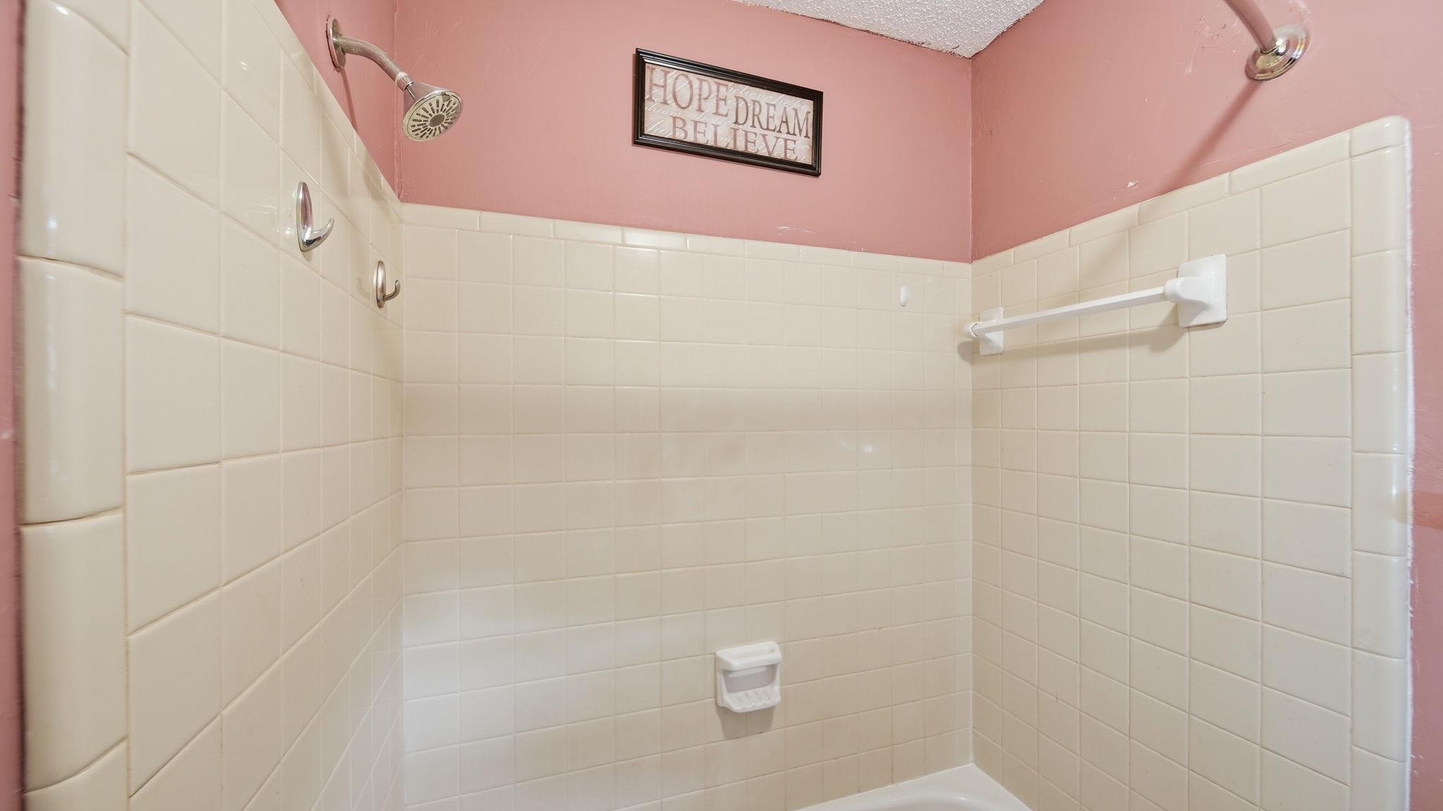 5069 Ross Road Memphis, TN 38141 - Photo 23 of 40 Bathroom featuring tub / shower combination and a textured ceiling