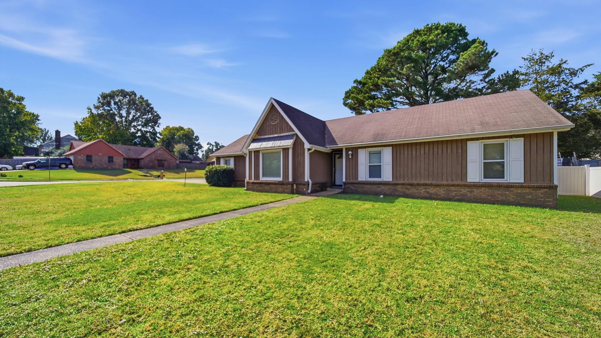 5069 Ross Road Memphis, TN 38141 - Photo 3 of 40 View of front facade featuring brick siding and board and batten siding