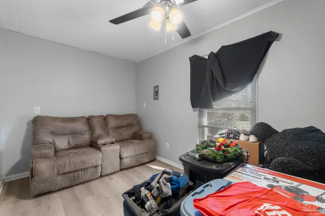 a living room with furniture and flowers
