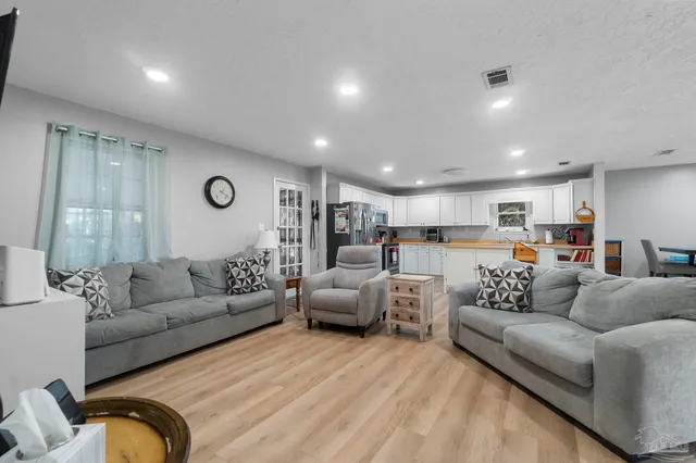 a living room with furniture white walls and white walls