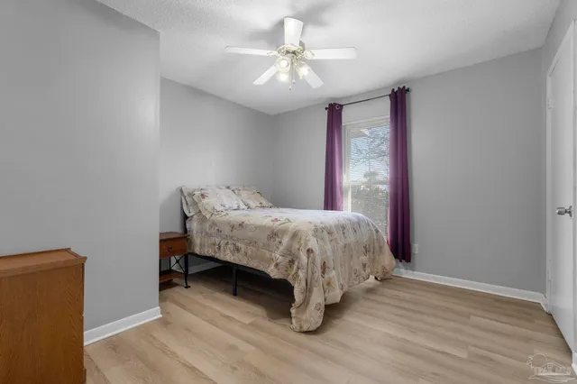 a bed room with a bed and a chandelier