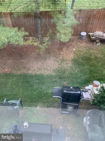 a backyard of a house with outdoor seating