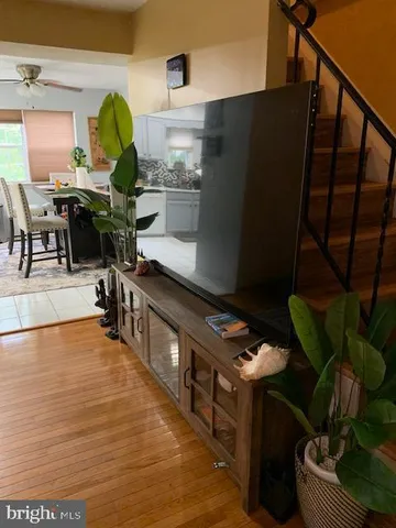 a kitchen with stainless steel appliances granite countertop a refrigerator a stove and a sink