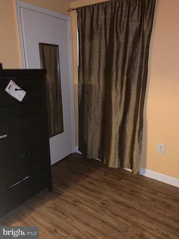 a view of a elevator with wooden floor