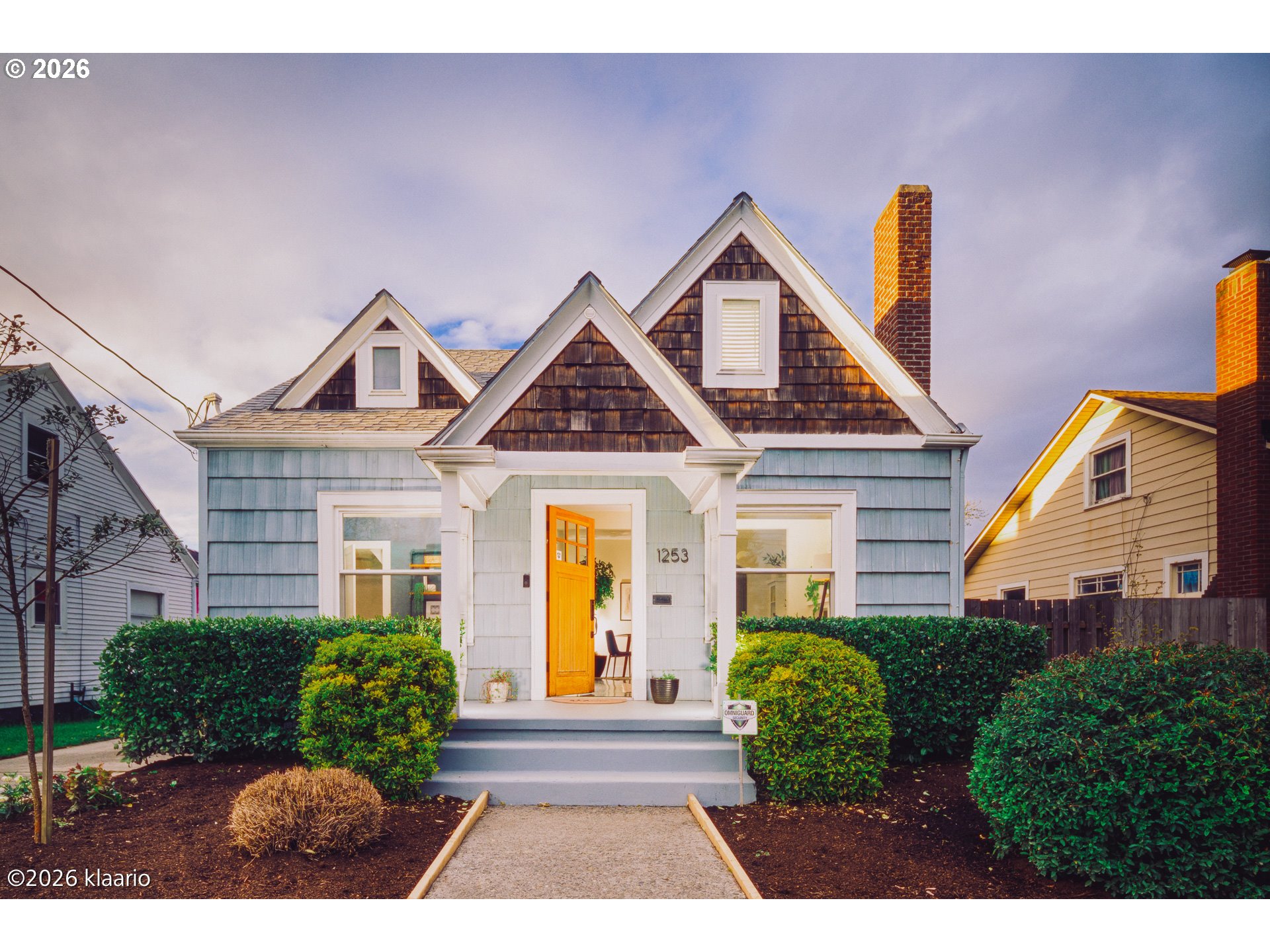 1253 North Baldwin Street Portland, OR 97217 - Photo 1 of 30 a front view of a house with garden