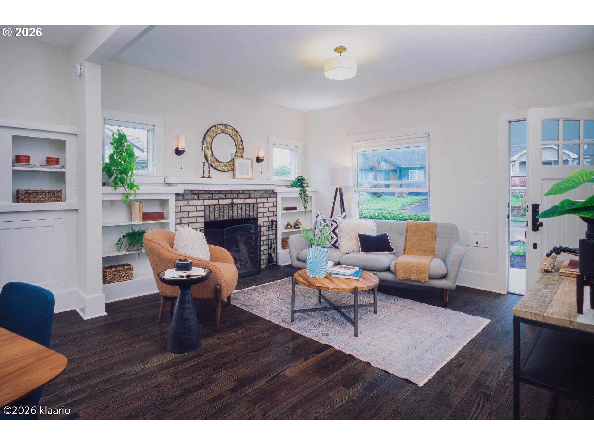 1253 North Baldwin Street Portland, OR 97217 - Photo 2 of 30 a living room with furniture a fireplace and a table