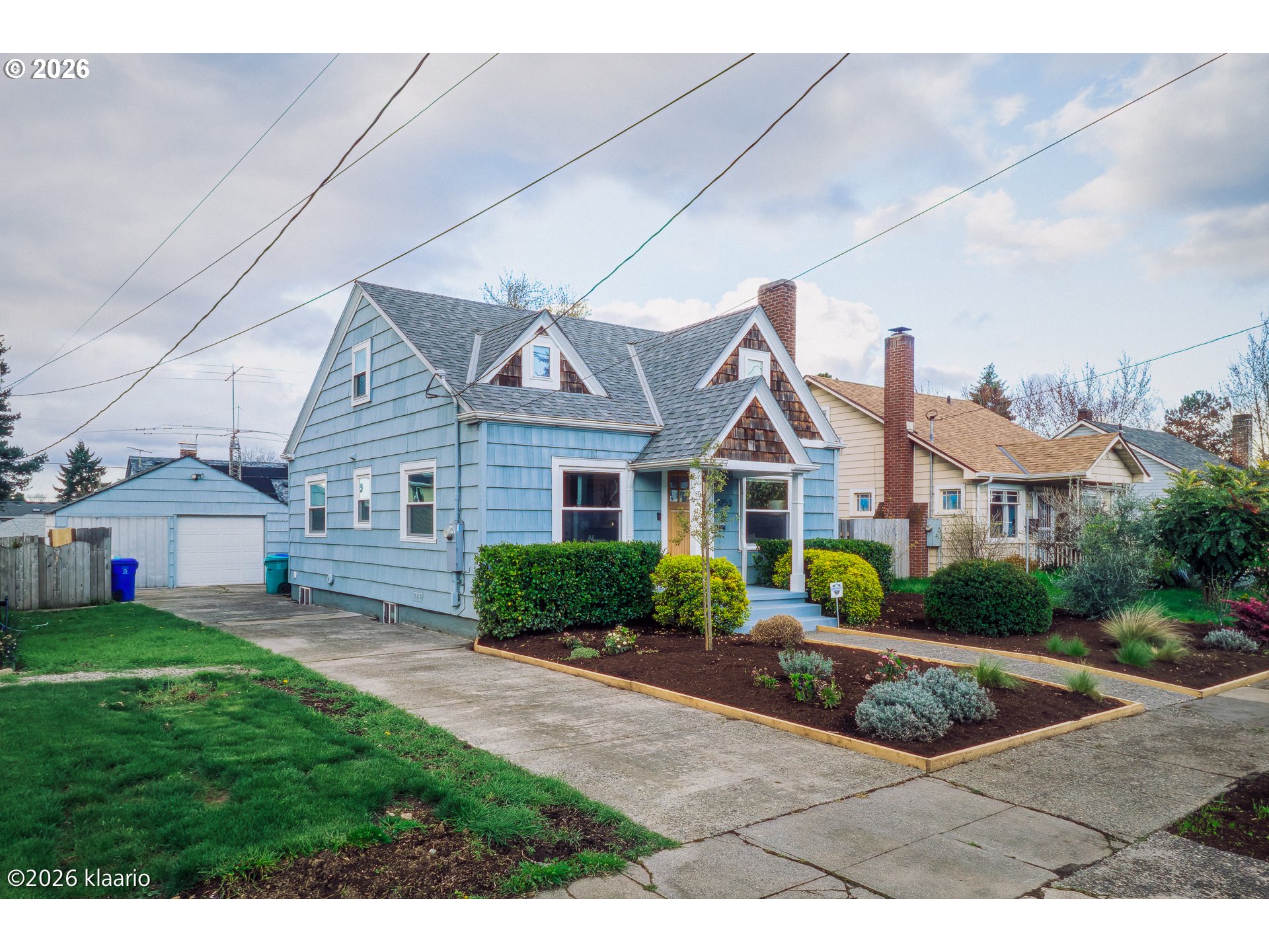 1253 North Baldwin Street Portland, OR 97217 - Photo 26 of 30 a front view of a house with a yard