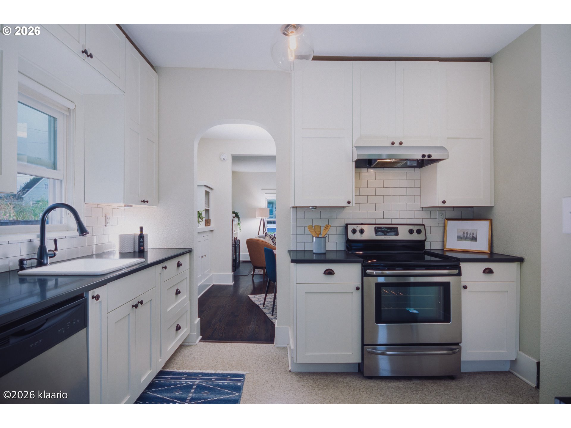 1253 North Baldwin Street Portland, OR 97217 - Photo 7 of 30 a kitchen with a stove and a sink
