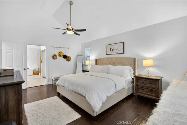 a bedroom with bed and window