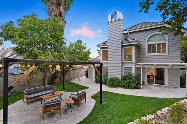 a view of a yard with furniture and a yard