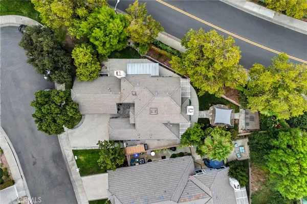 an aerial view of a house with a yard and garden