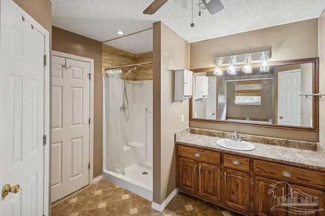 a bathroom with a granite countertop sink mirror and double