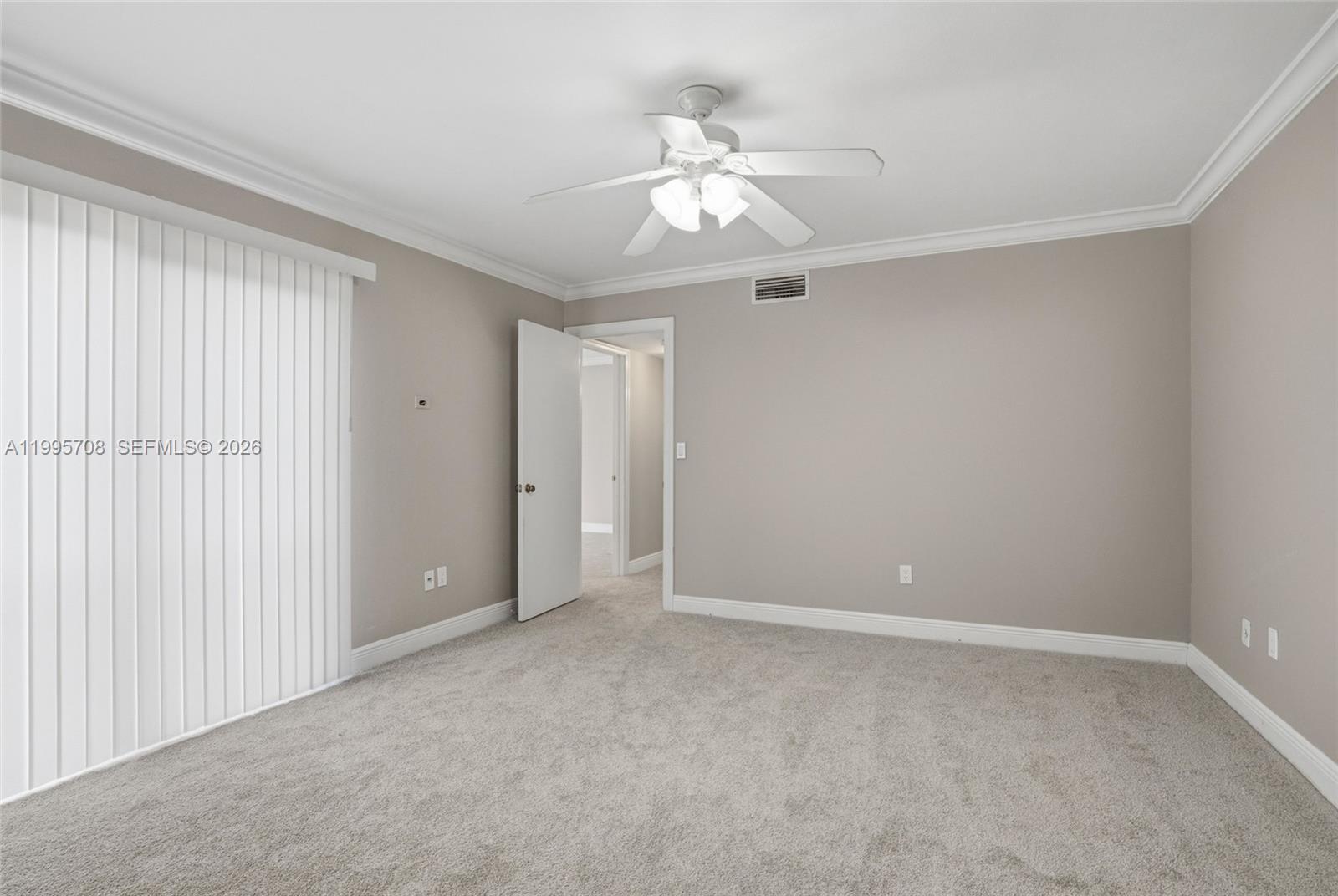 13993 Southwest 94th Cir Lane, Unit 1013 Miami, FL 33186 - Photo 20 of 36 a view of an empty room with a chandelier fan