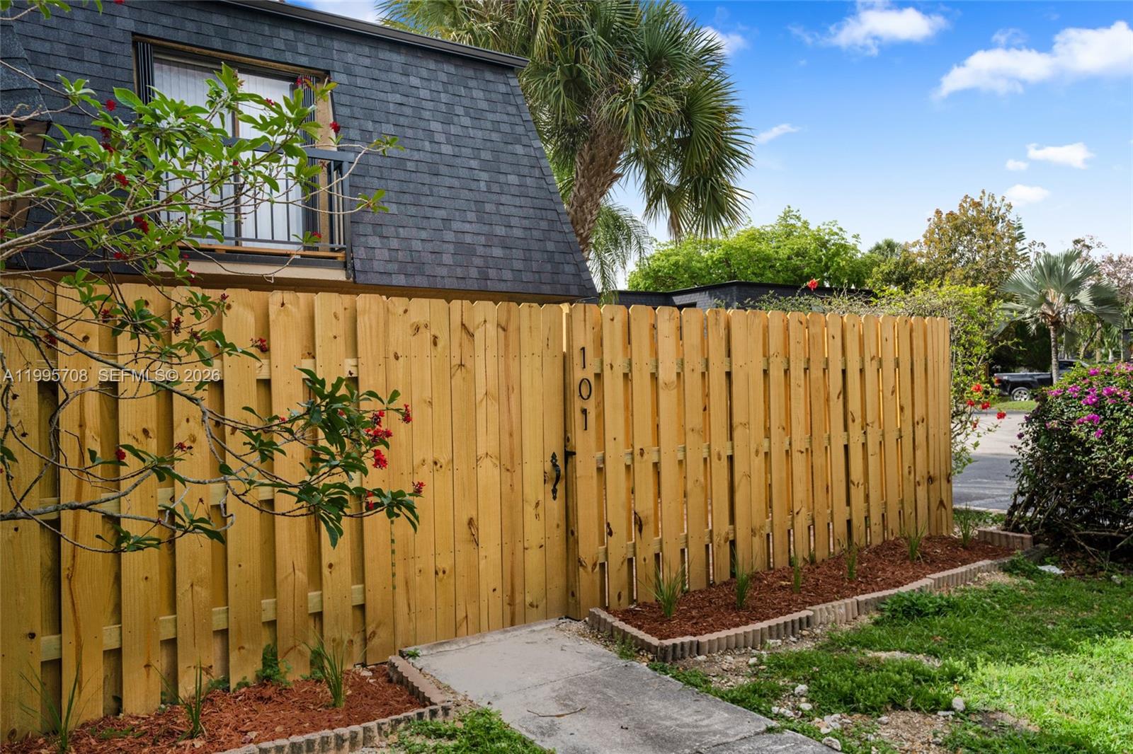 13993 Southwest 94th Cir Lane, Unit 1013 Miami, FL 33186 - Photo 2 of 36 a view of a pathway with a backyard