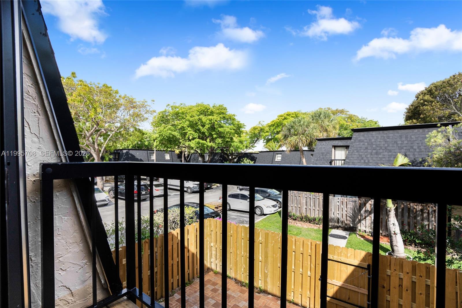 13993 Southwest 94th Cir Lane, Unit 1013 Miami, FL 33186 - Photo 25 of 36 a view of a street from a balcony