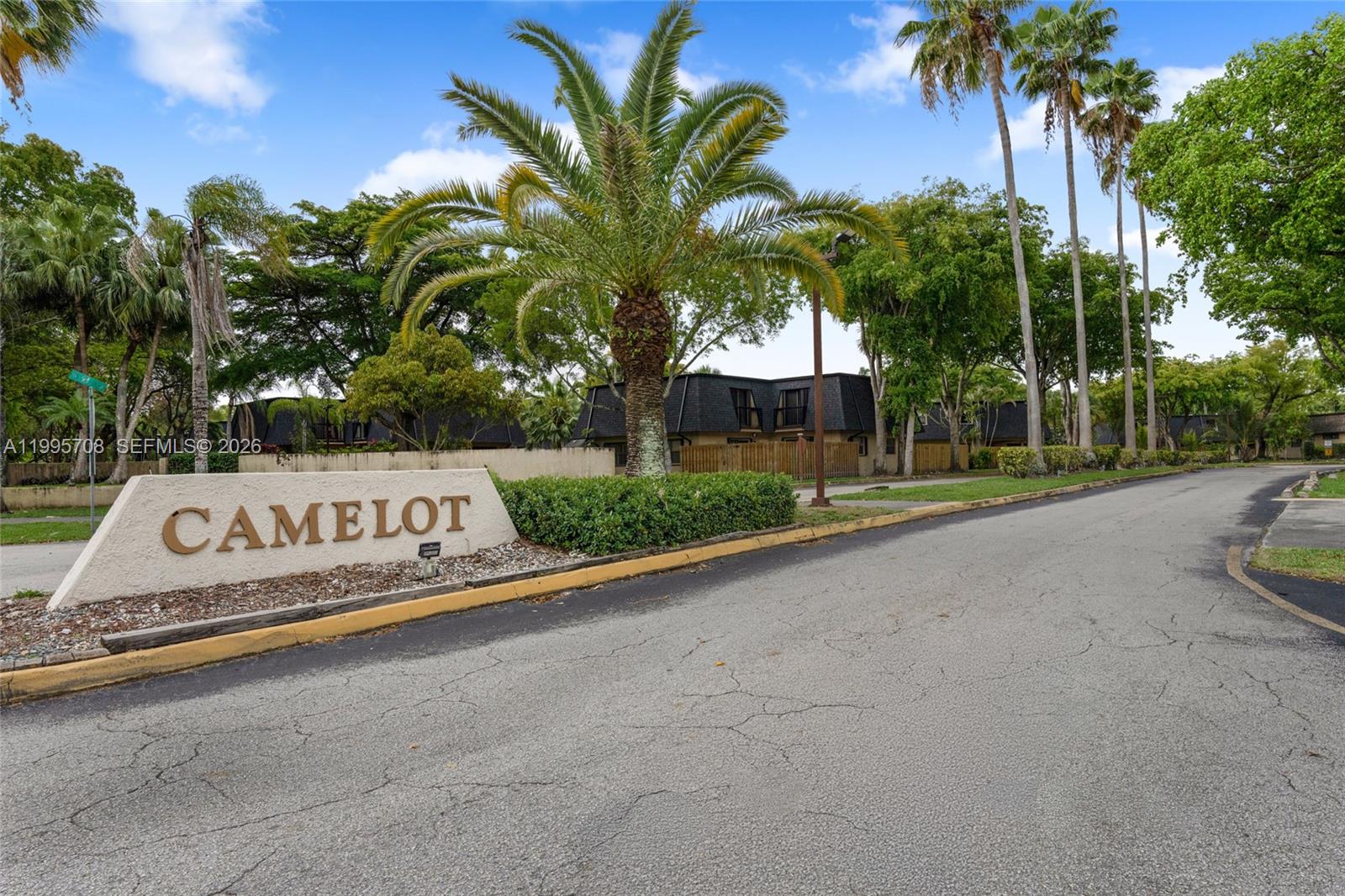 13993 Southwest 94th Cir Lane, Unit 1013 Miami, FL 33186 - Photo 31 of 36 a view of sign board with palm trees