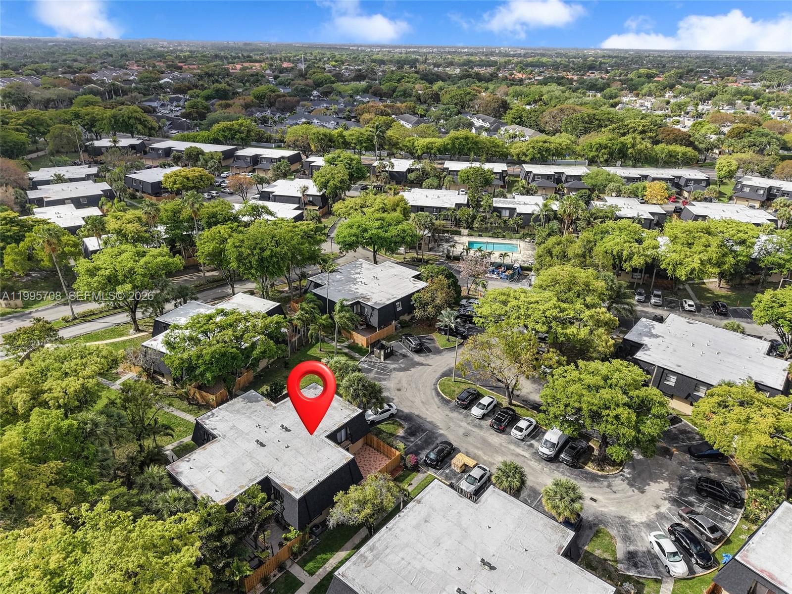 13993 Southwest 94th Cir Lane, Unit 1013 Miami, FL 33186 - Photo 33 of 36 an aerial view of residential houses with outdoor space and trees