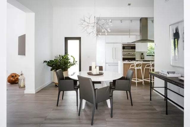 a dining room with furniture and wooden floor