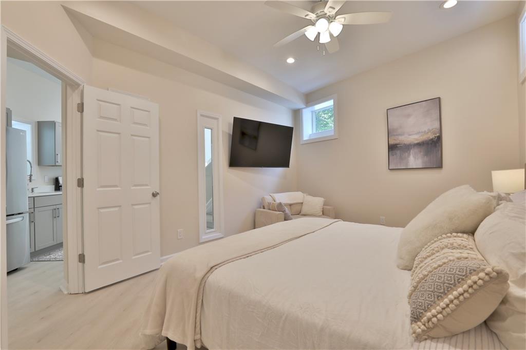 2125 Clay Road Southwest Austell, GA 30106 - Photo 21 of 25 a bedroom with a bed window and a flat screen tv