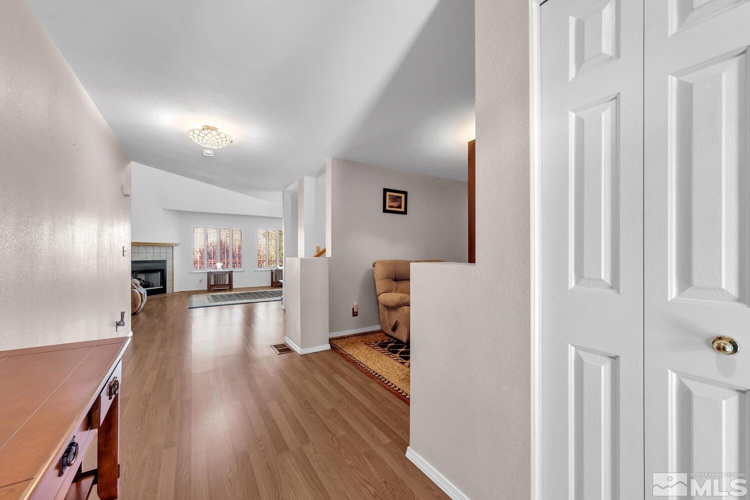 3186 Alpine Creek Road Reno, NV 89519 - Photo 3 of 36 a view of a living room and a wooden floor
