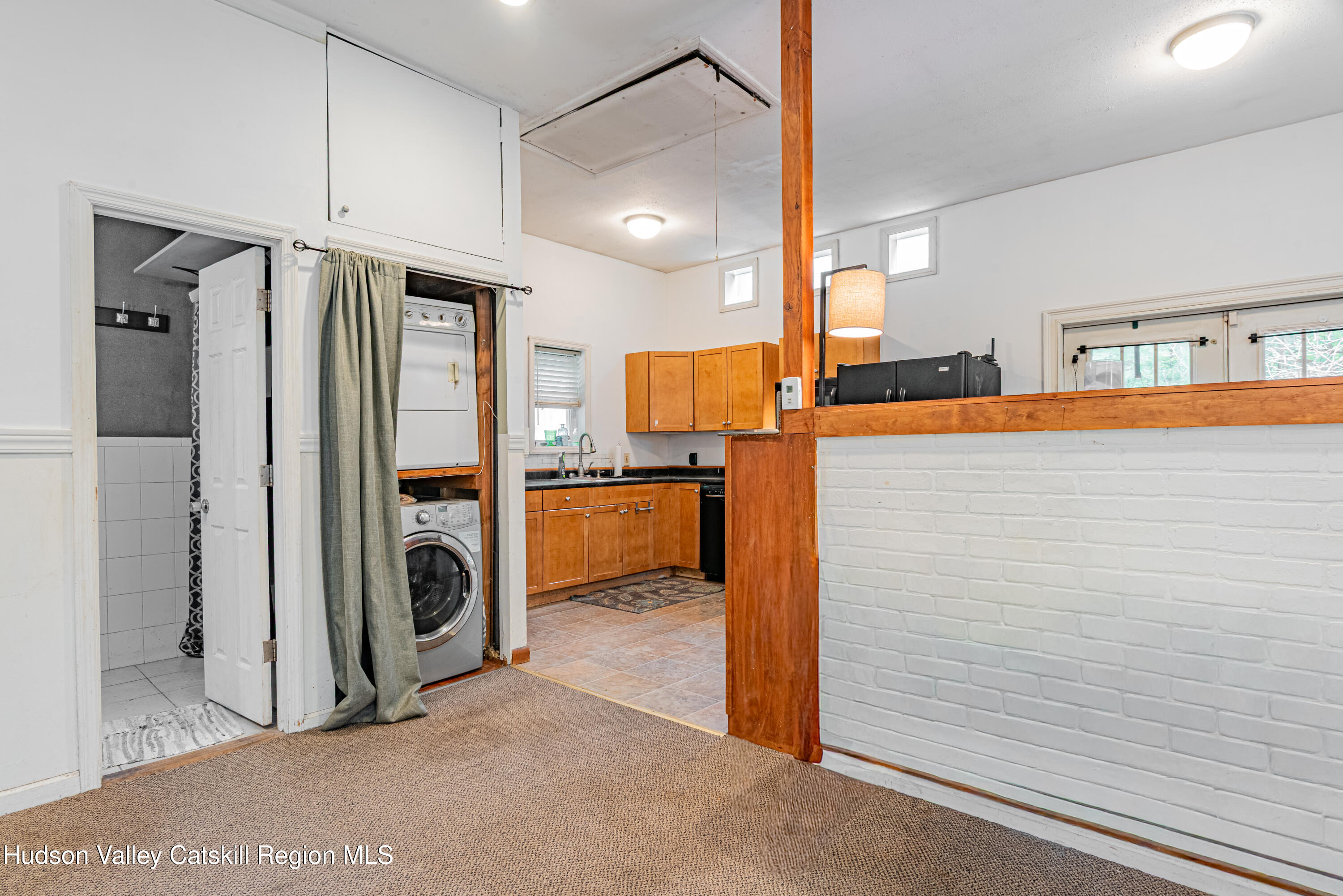 233 Rossway Road Pleasant Valley, NY 12569 - Photo 12 of 22 a kitchen with refrigerator a washer and dryer