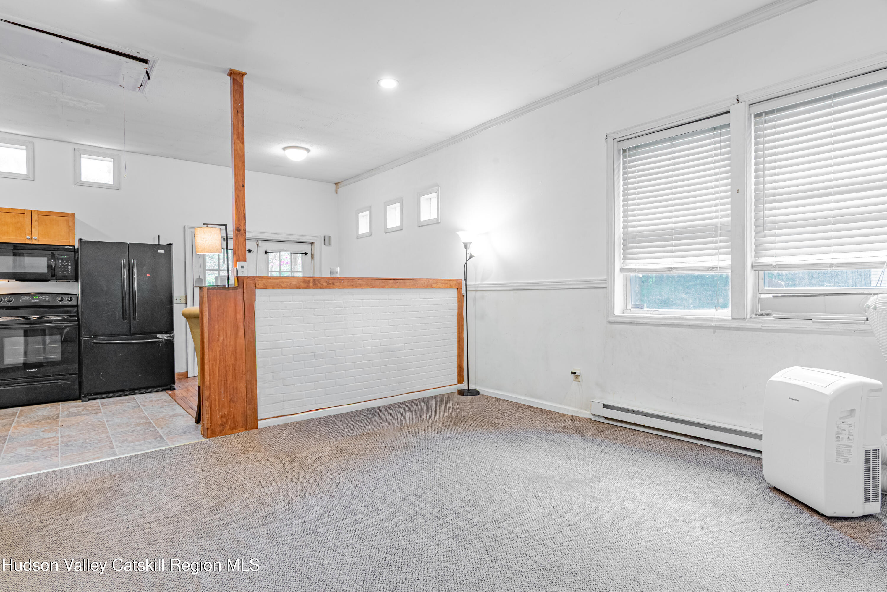 233 Rossway Road Pleasant Valley, NY 12569 - Photo 13 of 22 a view of a kitchen with a refrigerator and a sink