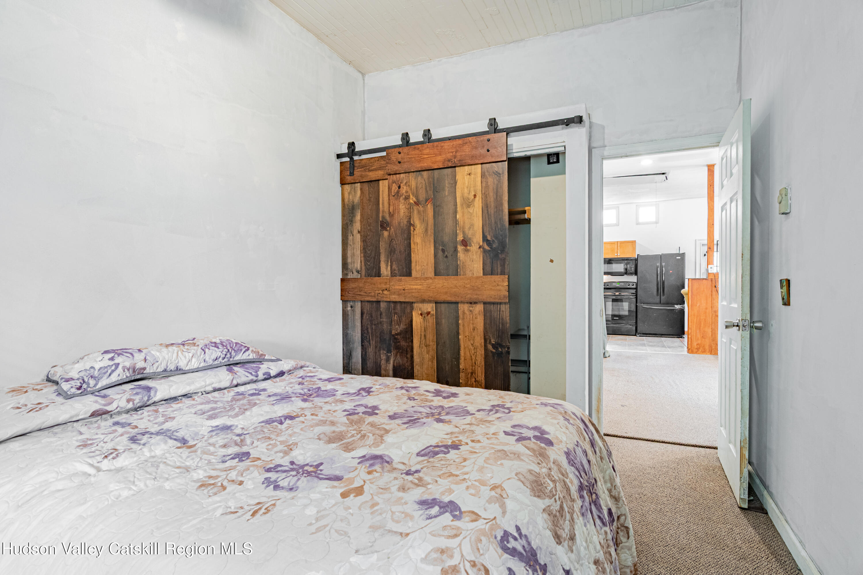 233 Rossway Road Pleasant Valley, NY 12569 - Photo 16 of 22 a bedroom with a bed and a window