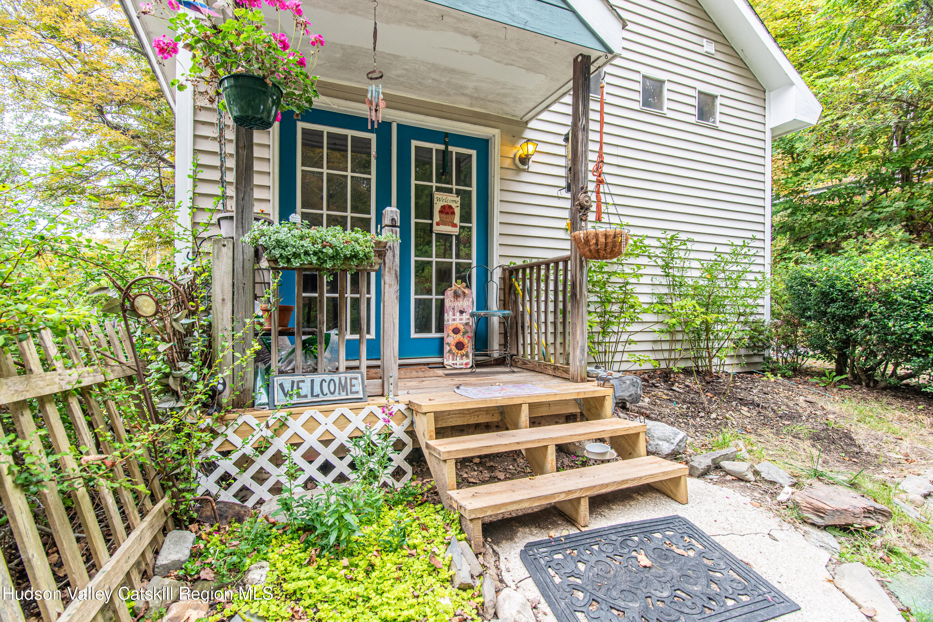 233 Rossway Road Pleasant Valley, NY 12569 - Photo 3 of 22 a balcony with furniture and flowers