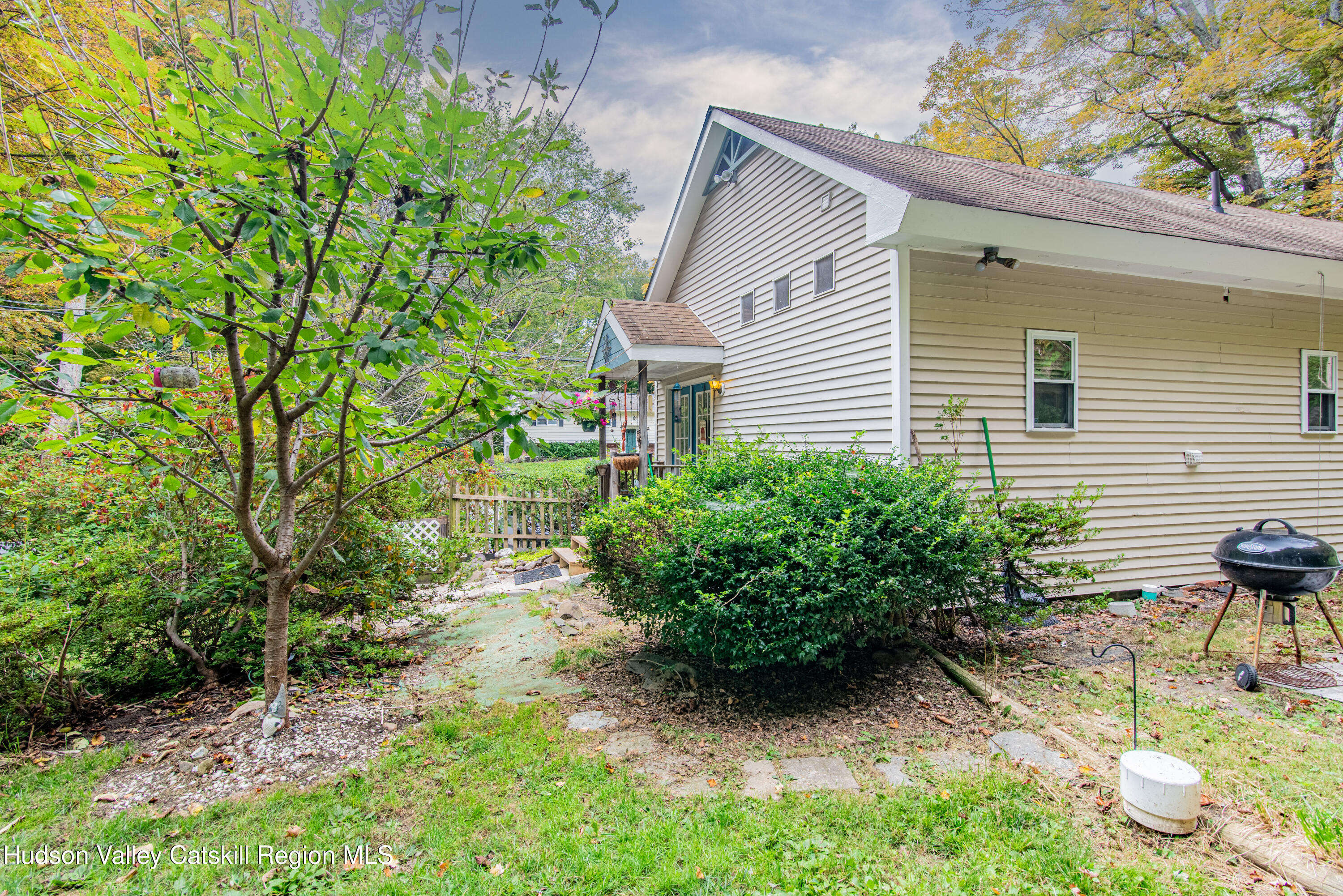 233 Rossway Road Pleasant Valley, NY 12569 - Photo 4 of 22 a backyard of a house with seating space