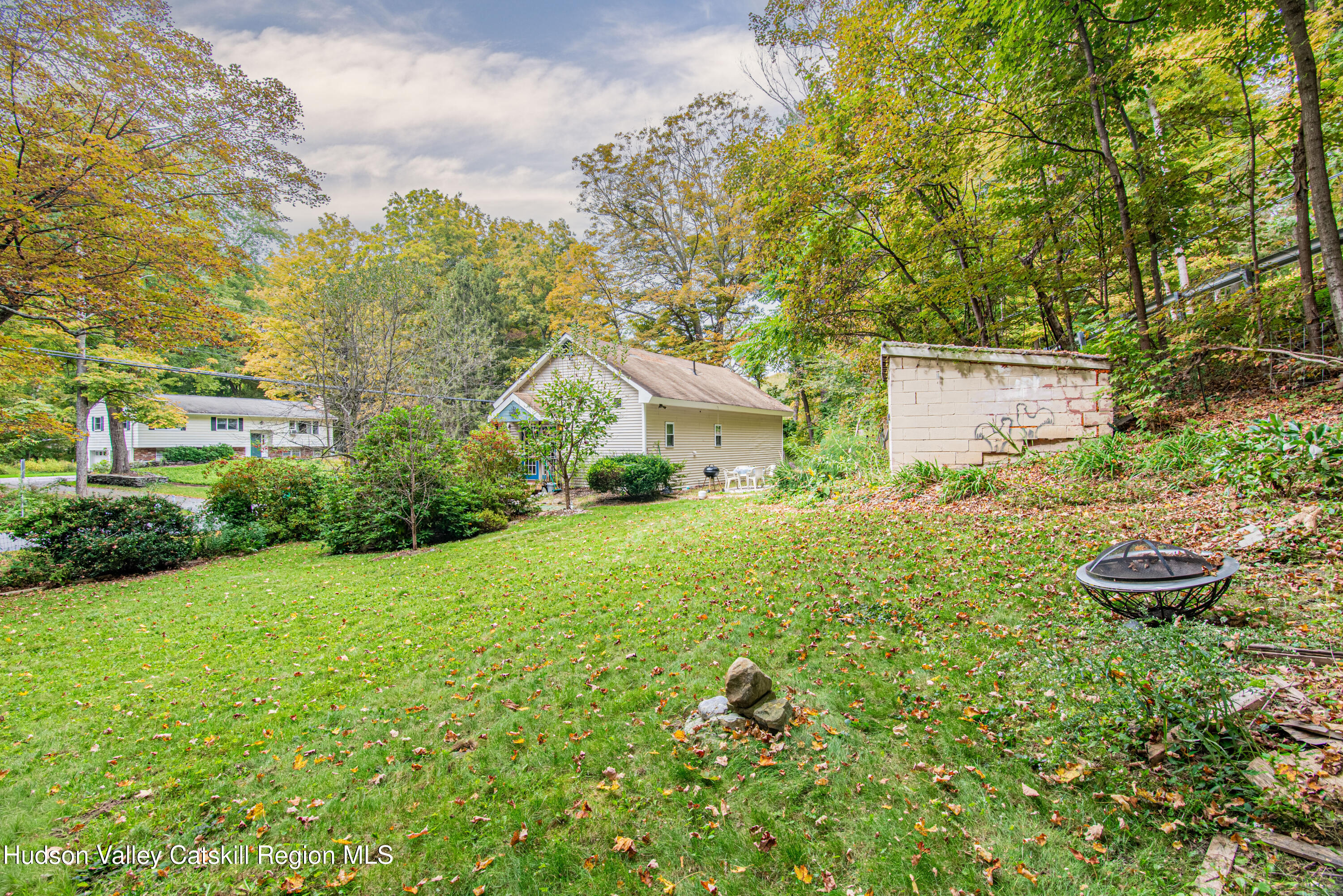 233 Rossway Road Pleasant Valley, NY 12569 - Photo 5 of 22 a front view of a house with a yard and trees