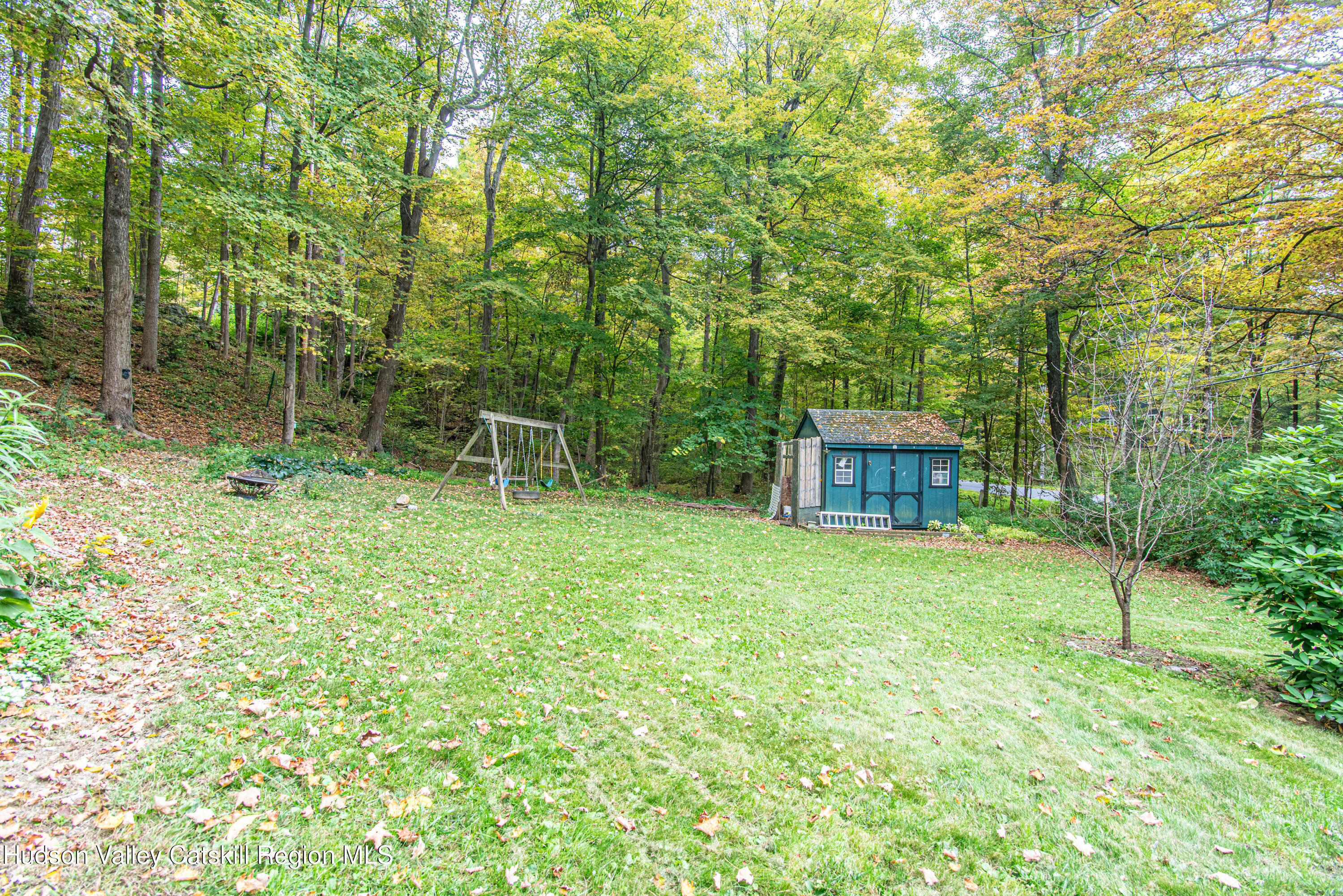 233 Rossway Road Pleasant Valley, NY 12569 - Photo 8 of 22 a backyard of a house with lots of green space and garden view