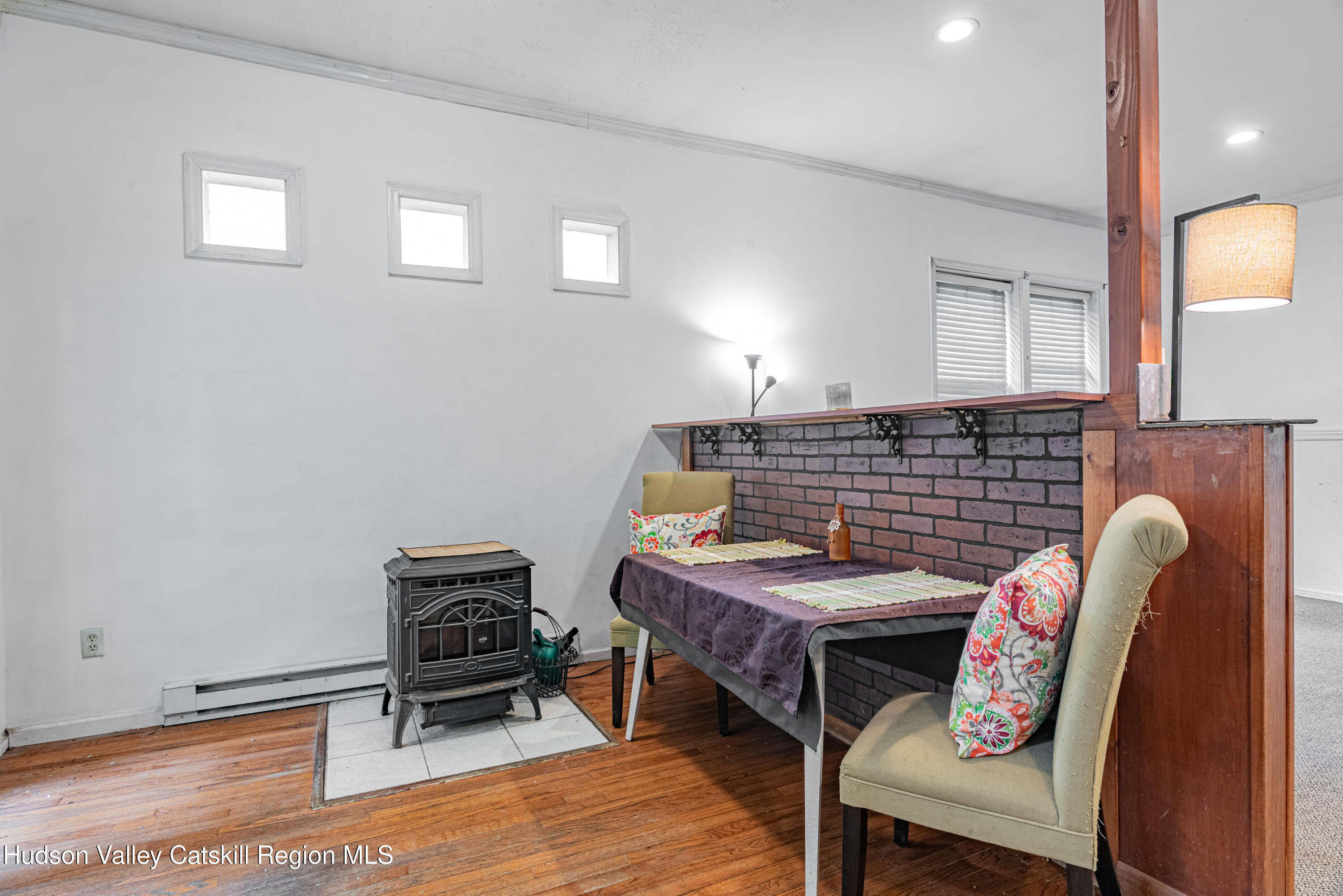 233 Rossway Road Pleasant Valley, NY 12569 - Photo 9 of 22 a view of a dining room with furniture and wooden floor