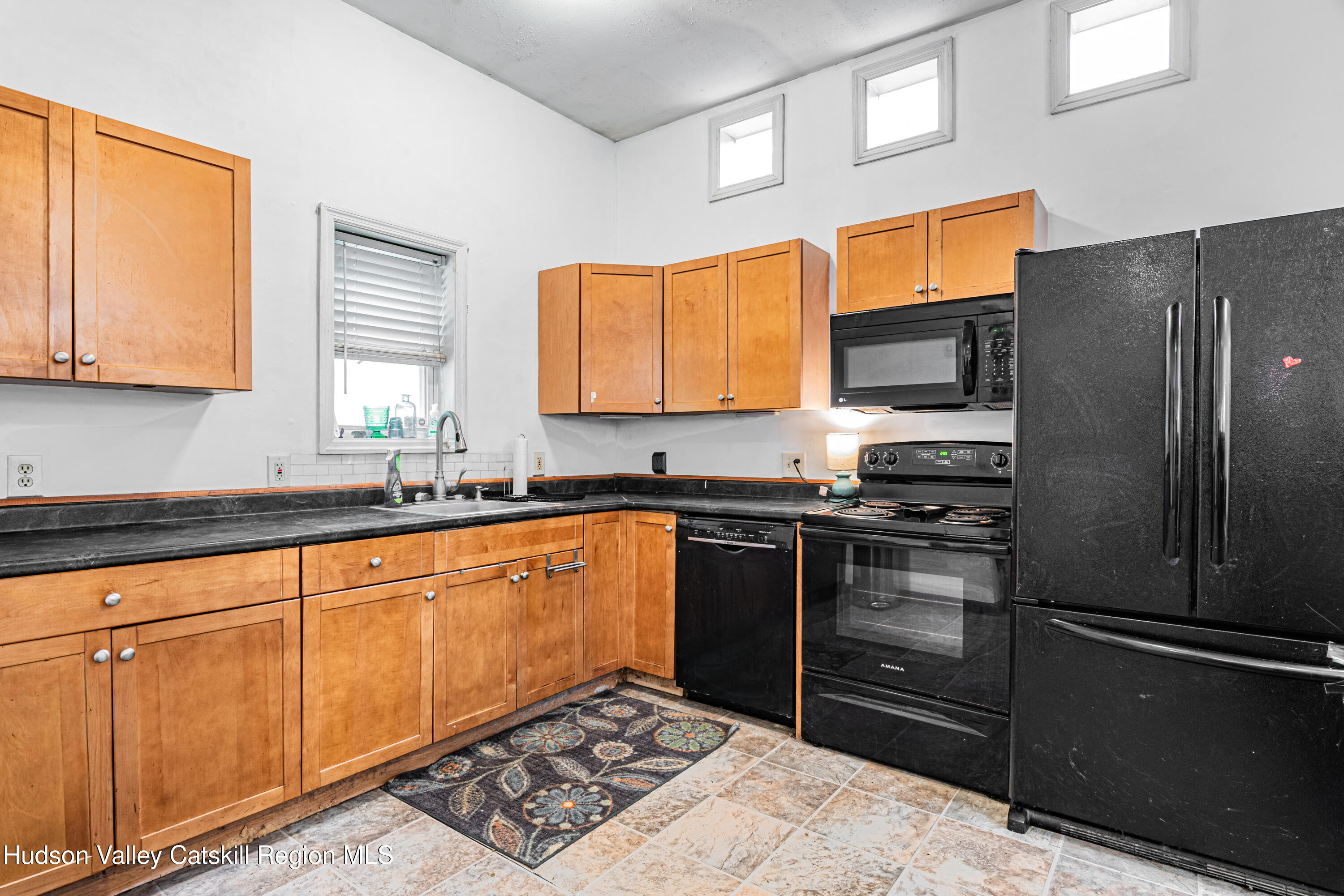 233 Rossway Road Pleasant Valley, NY 12569 - Photo 10 of 22 a kitchen with stainless steel appliances granite countertop a refrigerator and a sink