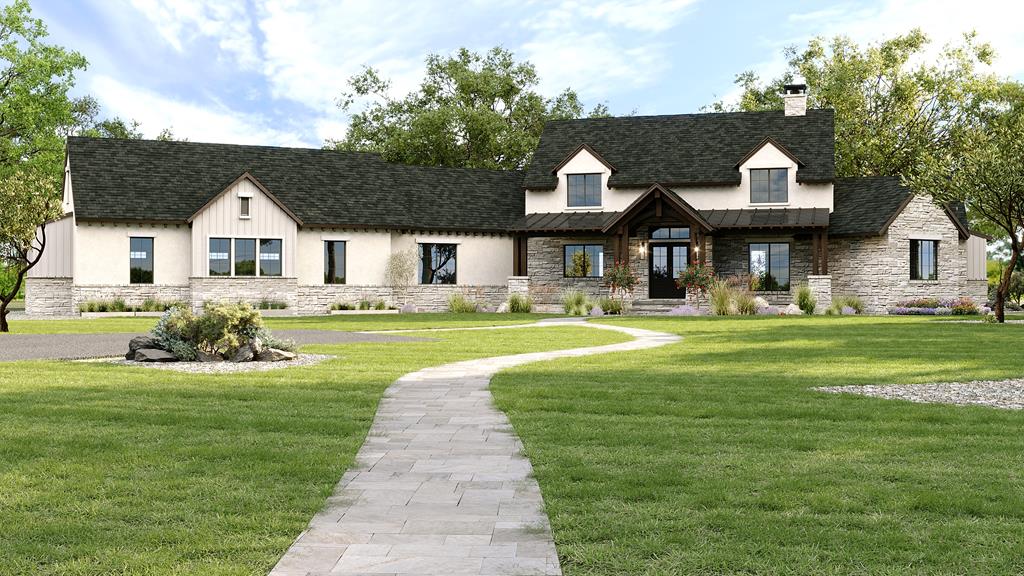 a front view of a house with a garden and trees