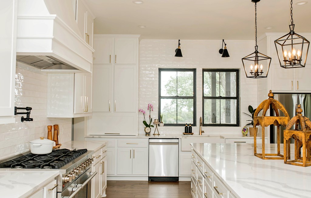 674 Windmill Ridge Drive Blanco, TX 78606 - Photo 5 of 13 a kitchen with stainless steel appliances granite countertop a stove and a sink