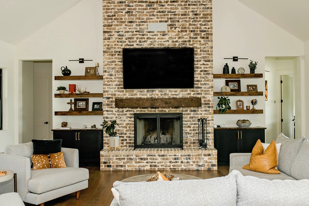 674 Windmill Ridge Drive Blanco, TX 78606 - Photo 6 of 13 a living room with furniture and a fireplace