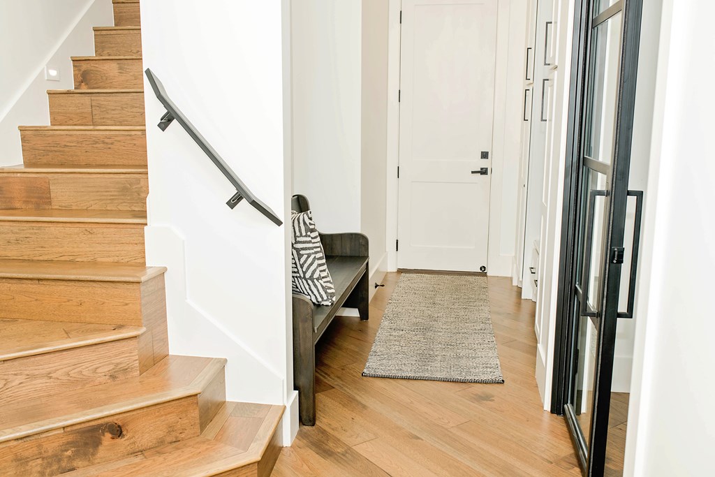 674 Windmill Ridge Drive Blanco, TX 78606 - Photo 8 of 13 a view of a hallway with wooden floor and staircase