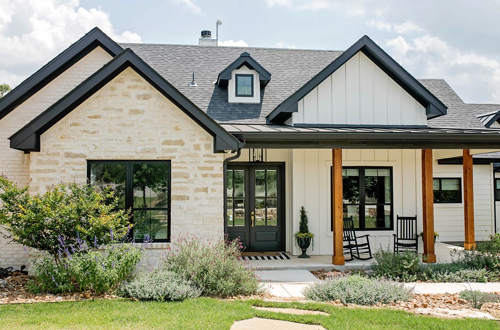674 Windmill Ridge Drive Blanco, TX 78606 - Photo 10 of 13 a front view of a house with garden