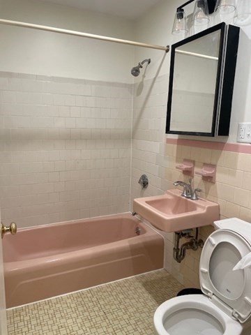 25 Custer Street, Unit 303 Boston, MA 02130 - Photo 5 of 8 a bathroom with a sink and a mirror