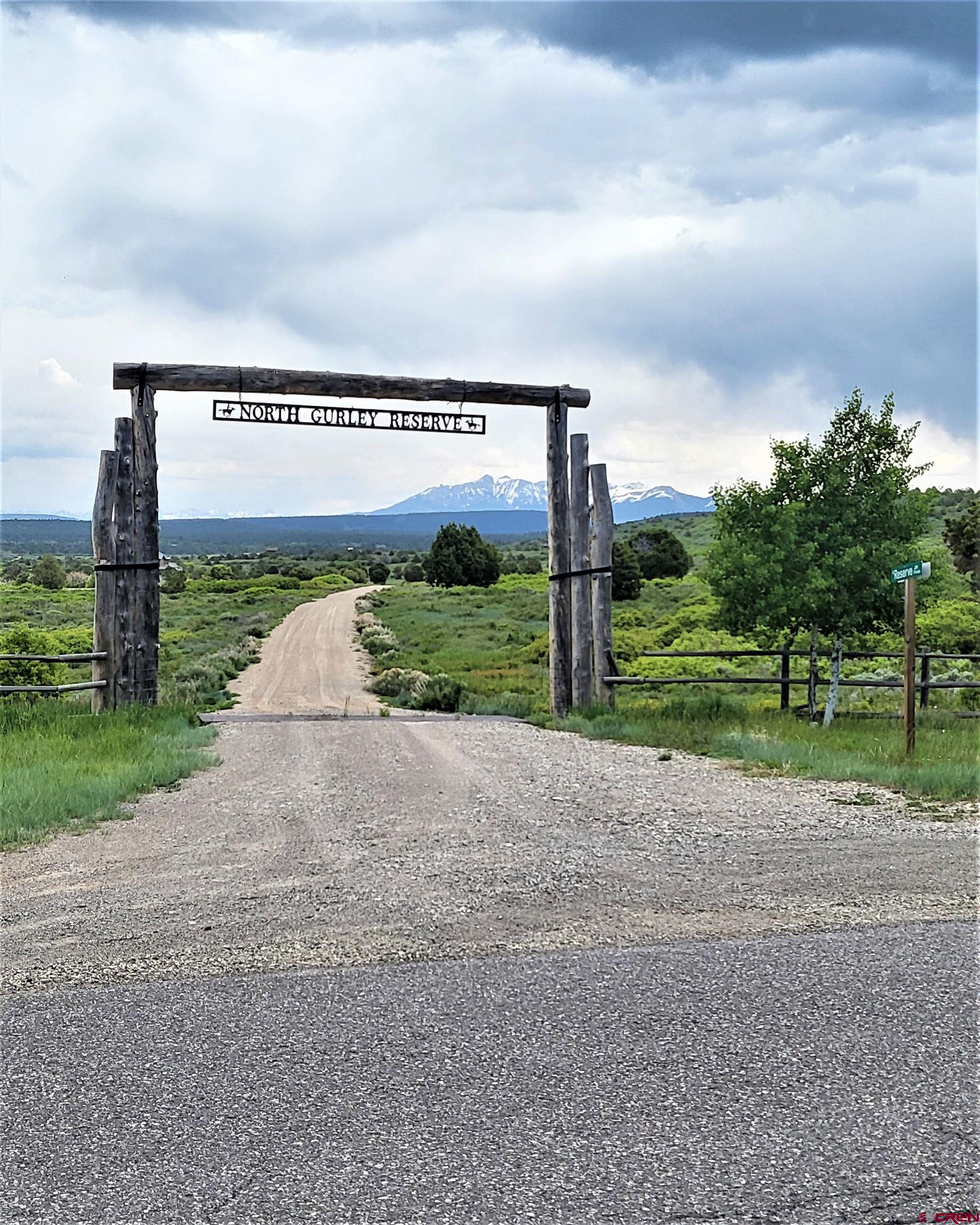 10 North Reserve Trail Norwood, CO 81423 - Photo 1 of 15 a view of a garden with a building in the background