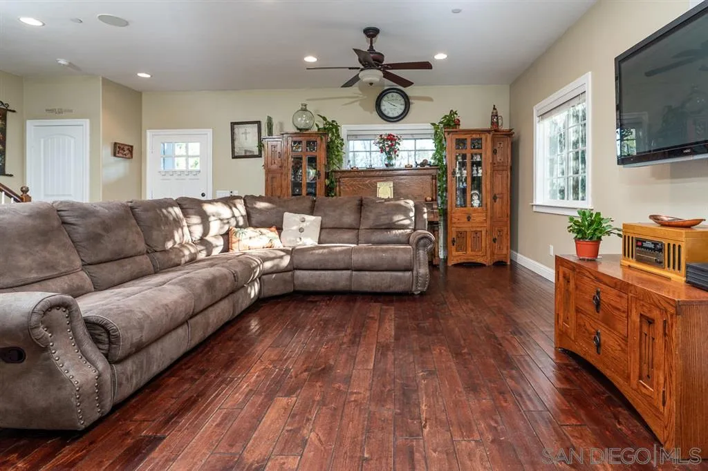 15860 Staples Road Ramona, CA 92065 - Photo 6 of 25 a living room with furniture kitchen view and a flat screen tv
