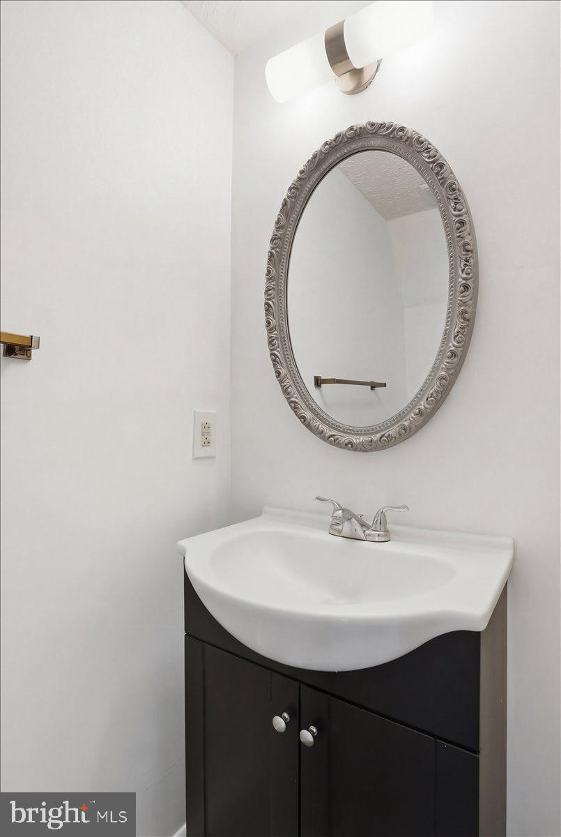 6734 Fallow Hill Court Frederick, MD 21703 - Photo 15 of 29 a bathroom with a sink and a mirror