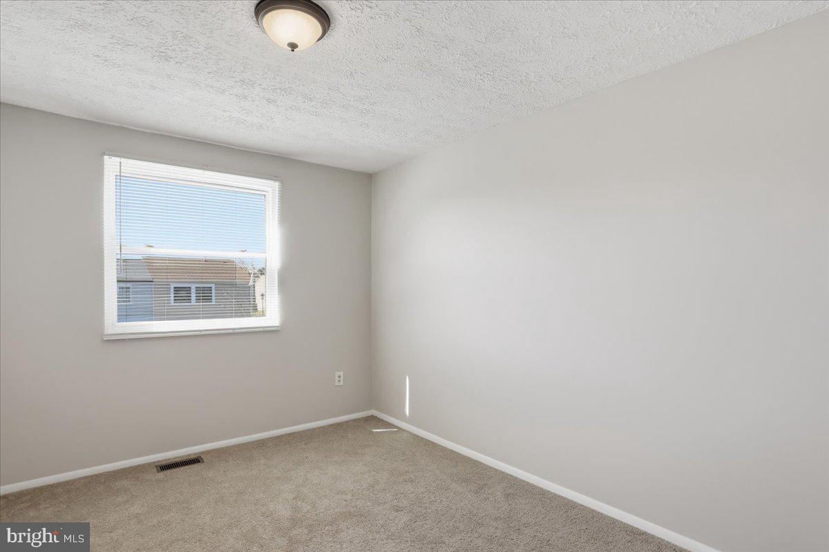 6734 Fallow Hill Court Frederick, MD 21703 - Photo 19 of 29 an empty room with a window