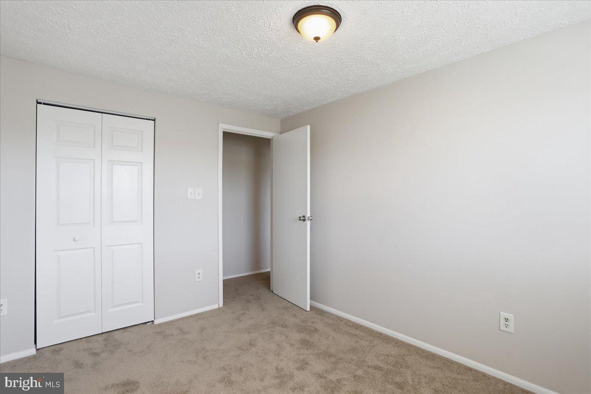6734 Fallow Hill Court Frederick, MD 21703 - Photo 20 of 29 an empty room with closet area
