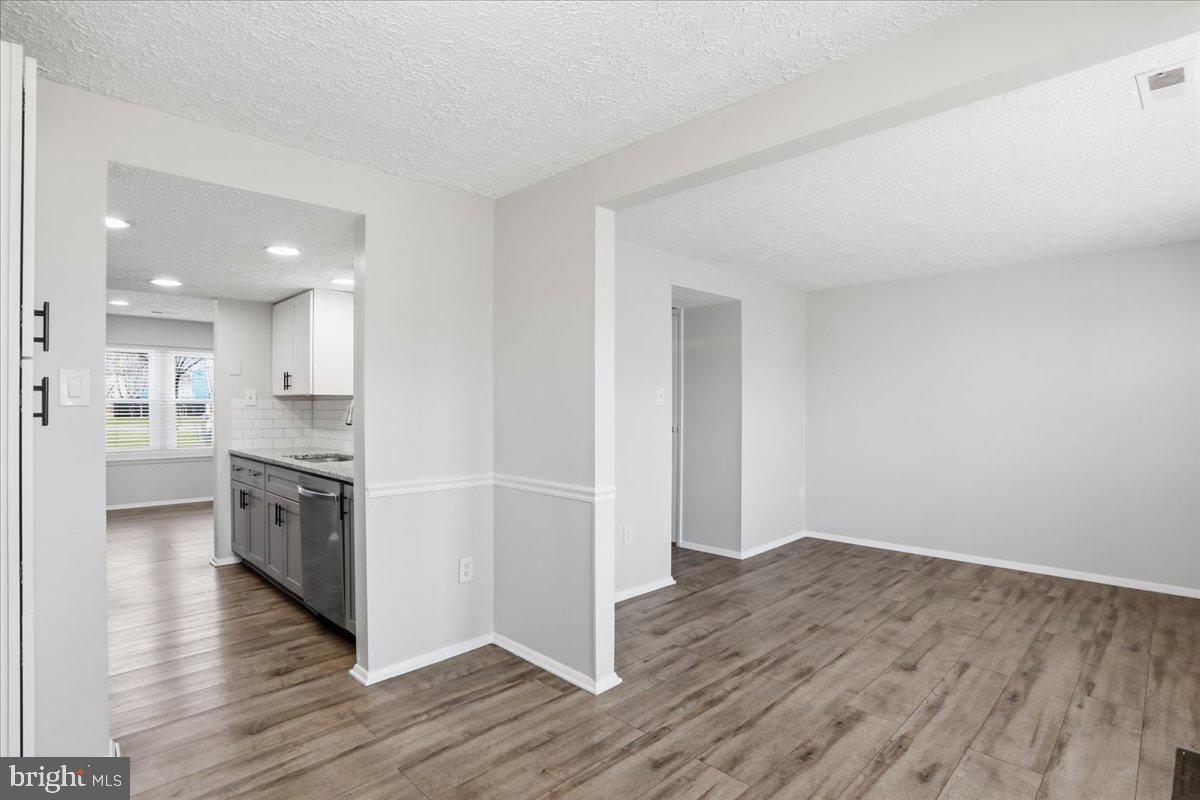6734 Fallow Hill Court Frederick, MD 21703 - Photo 2 of 29 a view of kitchen with wooden floor and electronic appliances