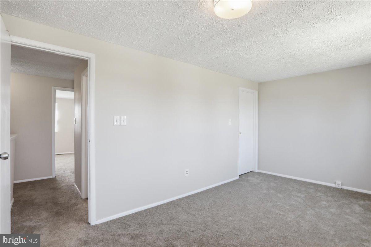 6734 Fallow Hill Court Frederick, MD 21703 - Photo 23 of 29 a view of an empty room