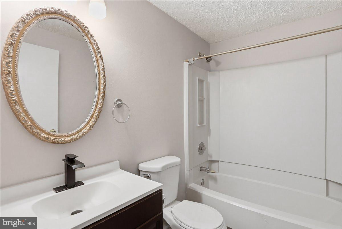 6734 Fallow Hill Court Frederick, MD 21703 - Photo 25 of 29 a bathroom with a sink a toilet and a mirror