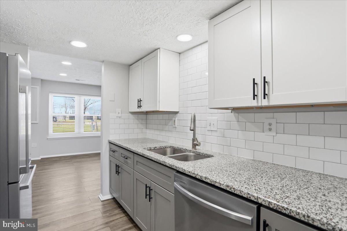 6734 Fallow Hill Court Frederick, MD 21703 - Photo 10 of 29 a kitchen with sink and cabinets