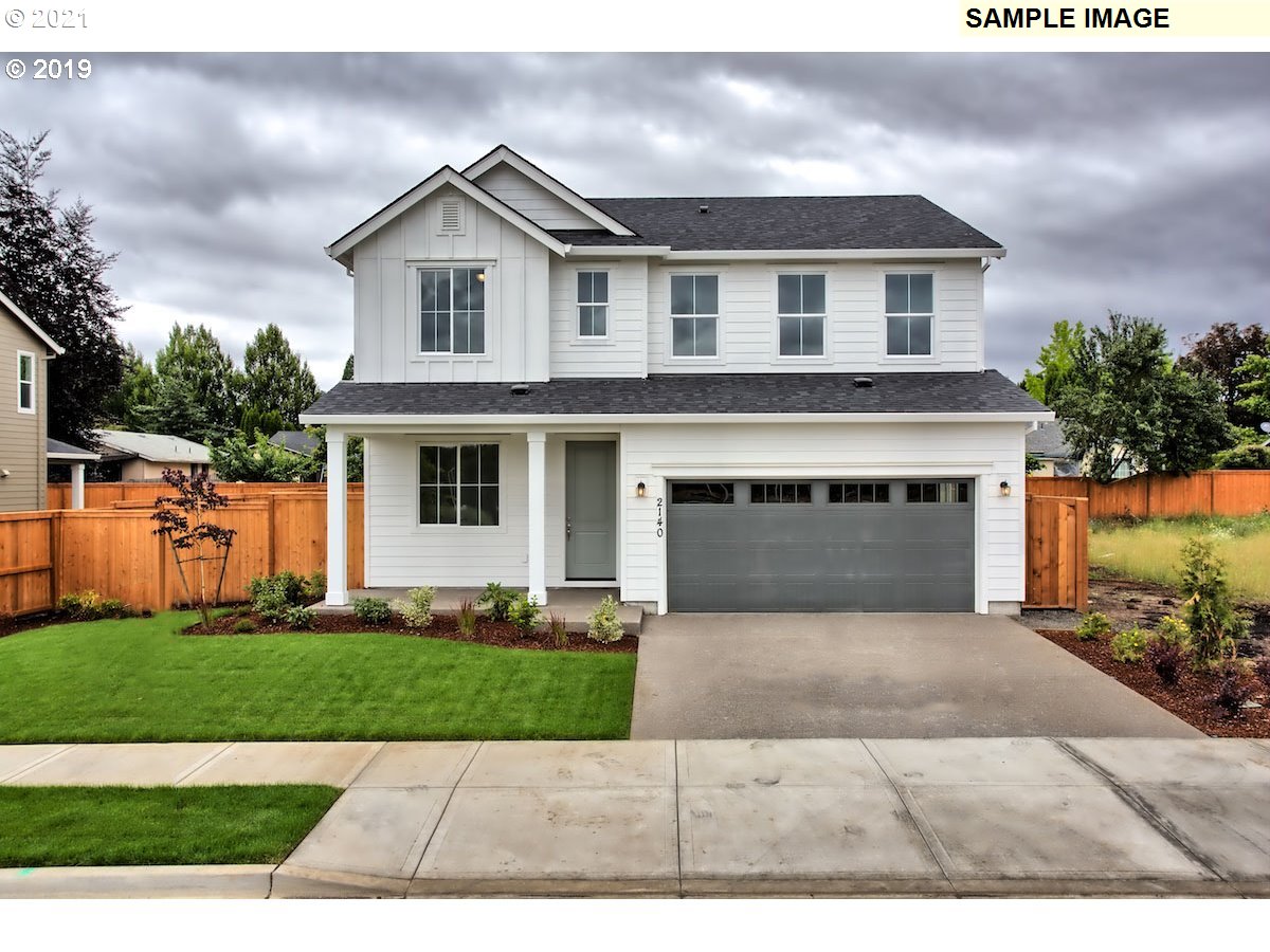 North Mccanta Way Ridgefield, WA 98642 - Photo 1 of 12 a front view of a house with a yard and garage
