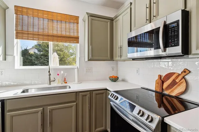 a kitchen with a sink and a stove